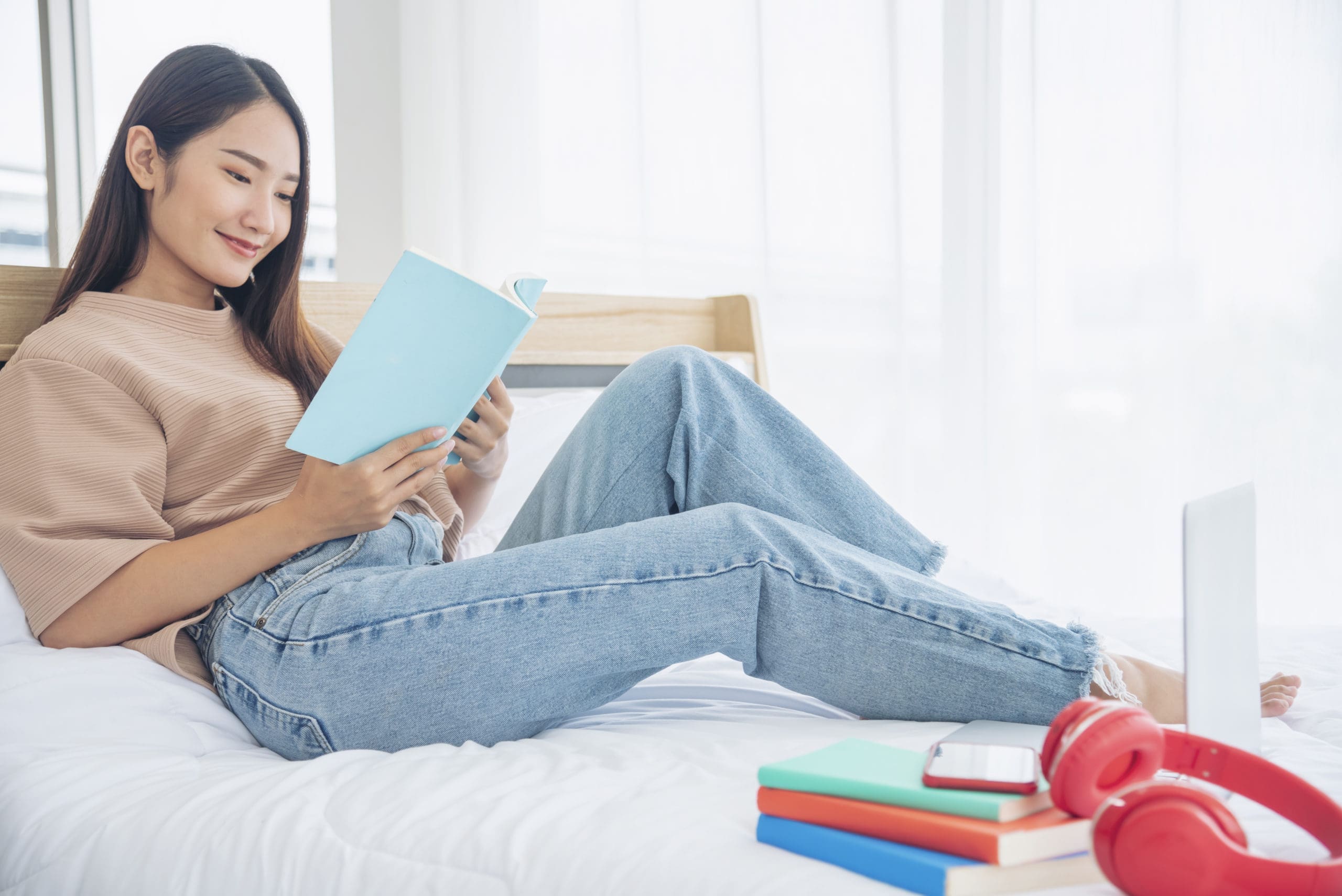 Relax Woman Holding Book Read At Bookshelf In University Library